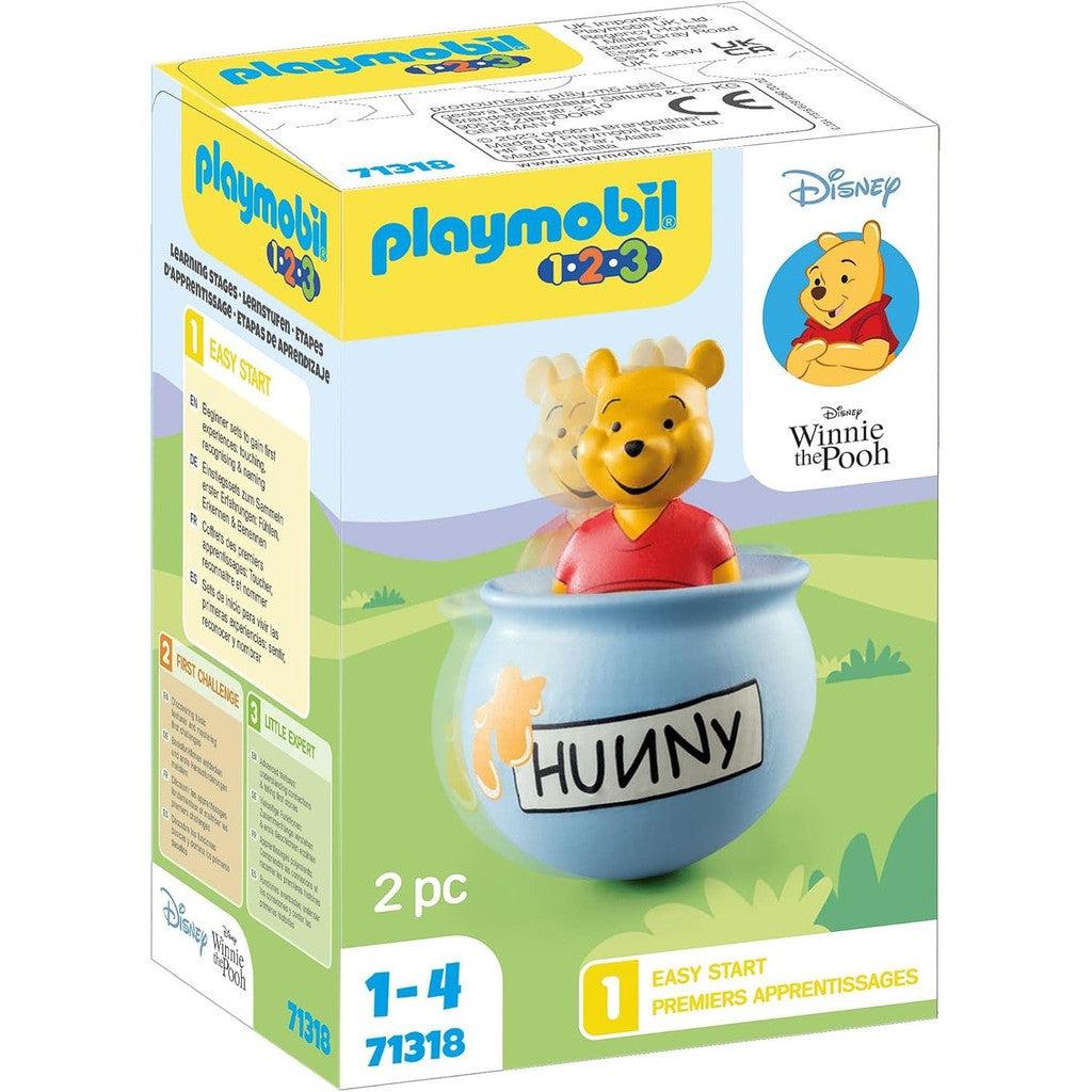 Discover the whimsical Playmobil 1.2.3 Disney Winnie the Pooh toy set, featuring Pooh nestled in a charming "Hunny" pot. Perfect for little ones aged 1-4, this delightful addition to Toys &amp; Games promises endless imaginative fun.