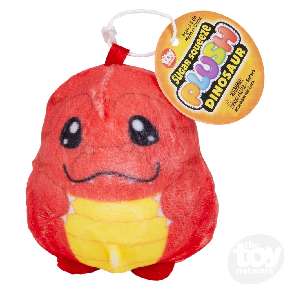 Red and yellow dinosaur plush toy with a smiling face and round black eyes, attached tag reads "Sugar Squeeze Plush Dinosaur.