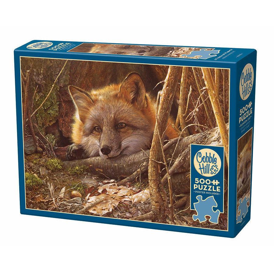 Box of a 500-piece Cobble Hill puzzle featuring an image of a fox resting in a wooded area.