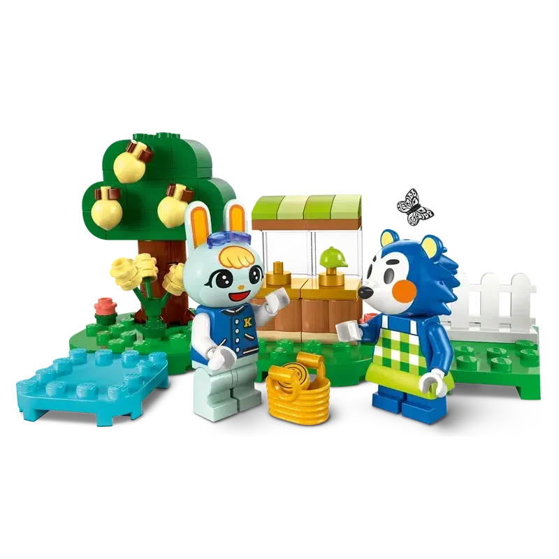 a close up of the two figures standing in front of the lego garden and shop stall.