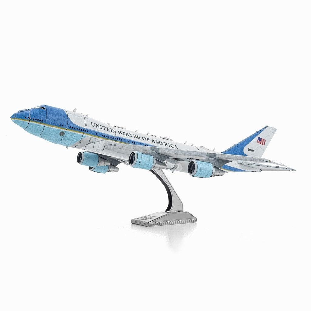 image shows a model silver and blue model airplane