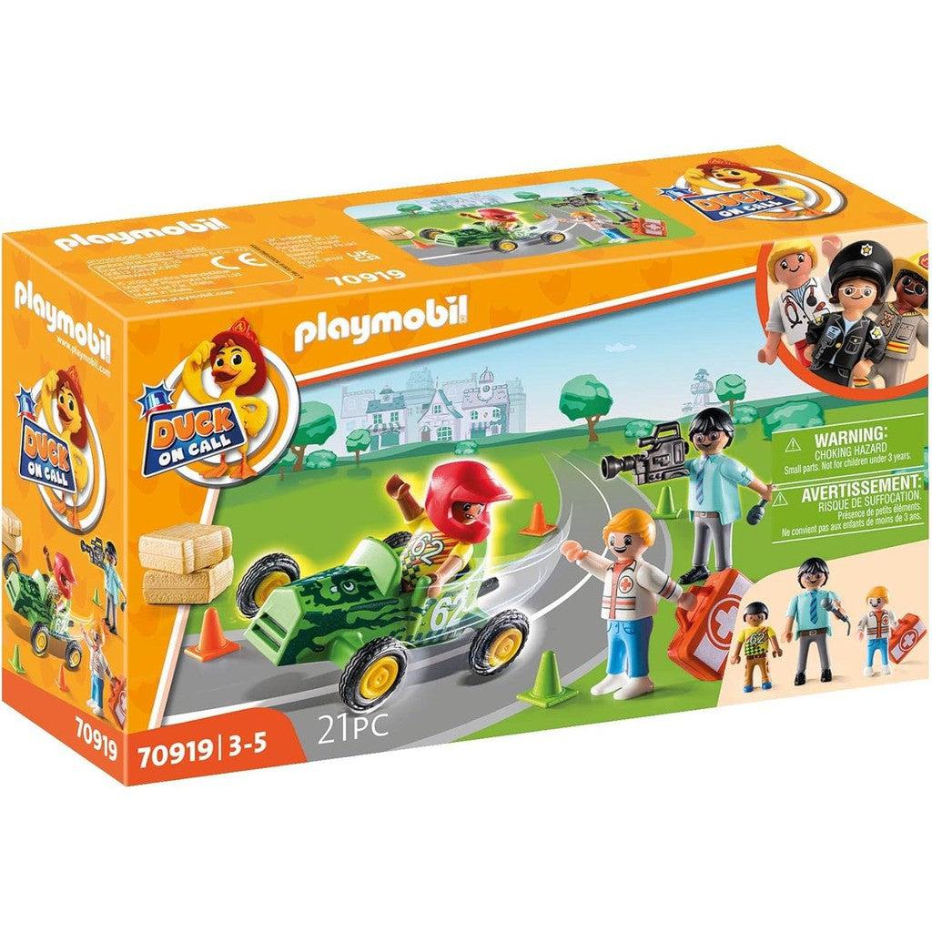 The Playmobil "Duck On Call" toy set offers endless Ambulance Action with a racer and figures, totaling 21 pieces. The box showcases vibrant toy scenes and important cautionary details, perfect for adventurous kids aged 3-5.