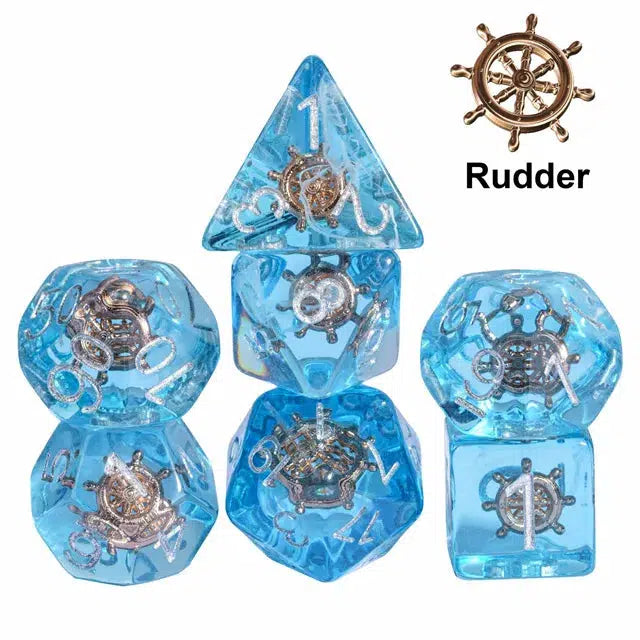 Set of blue polyhedral dice featuring silver ship wheel designs inside, labeled "Rudder." Perfect for Dungeons and Dragons or other role-playing games to add a nautical flair to your adventures.