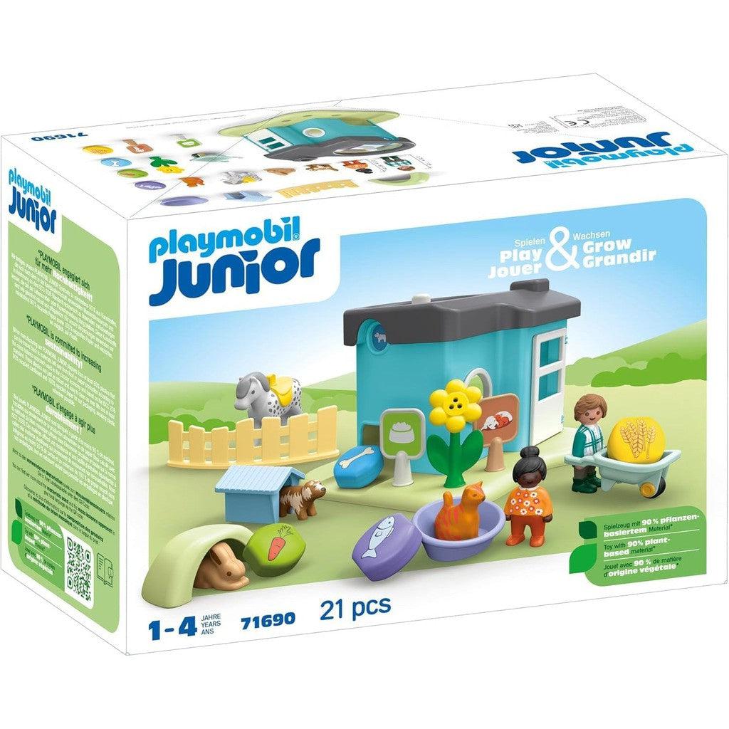 The Playmobil Junior set box features a delightful toy garden, house, figures, and accessories—perfect for creating an enchanting animal home. With 21 pieces suitable for ages 1-4, it offers endless imaginative play.