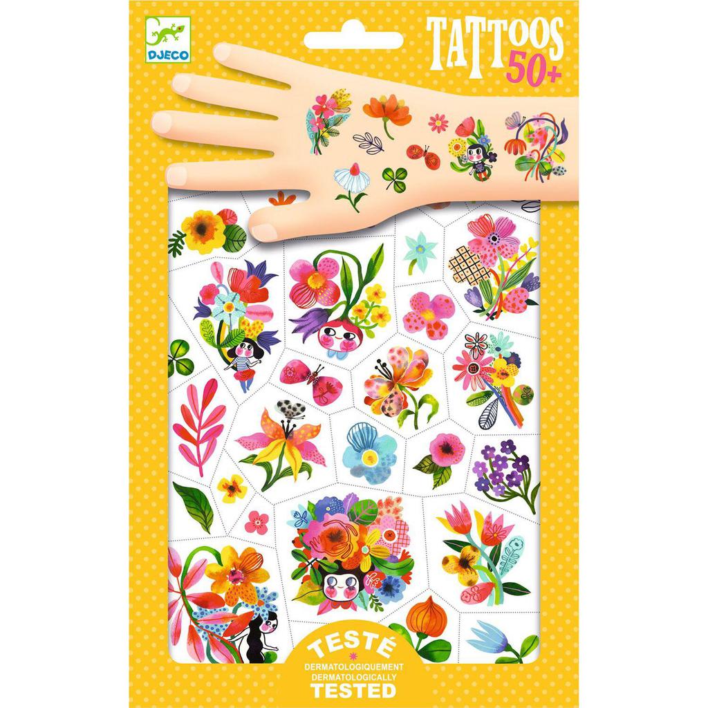 Package of colorful watercolor temporary tattoos, labeled "Tattoos 50+," with a hand artfully showcasing one playful design.