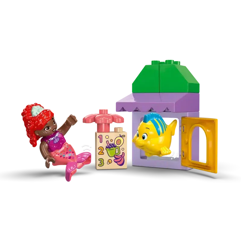 This buildable toy mermaid mini-figure and fish figure set features building blocks, a door, and decorative elements in pastel colors. Perfect as an educational toddler set, it encourages creativity and imaginative play amidst its charming underwater world.