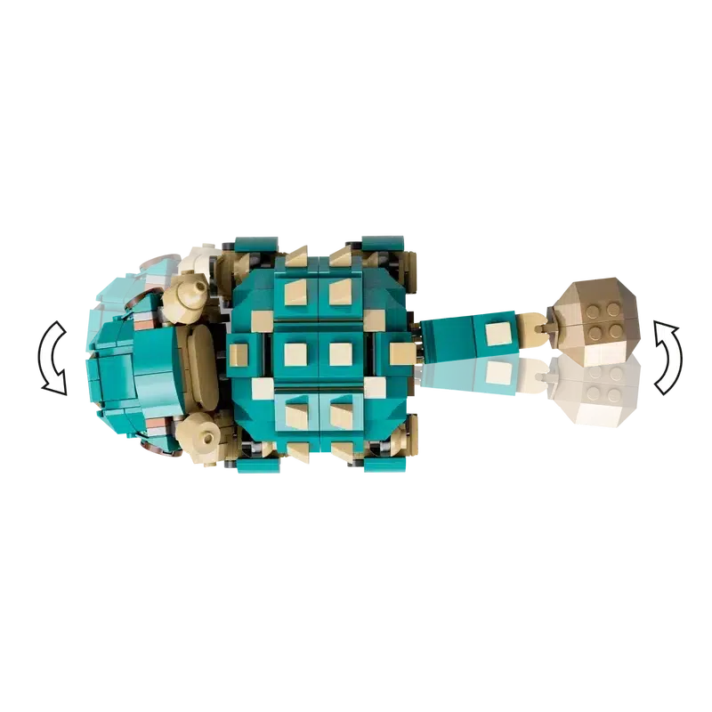 Top view of a turtle made from LEGO bricks in teal and beige colors, featuring a segmented shell and tail, reminiscent of the detail found in a Jurassic World toy.