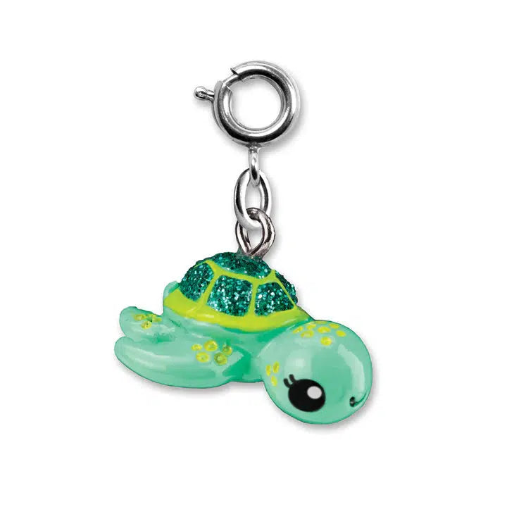 A cute green sea turtle charm with a glittery shell, perfect for your charm bracelet, attached to a small metal clasp.