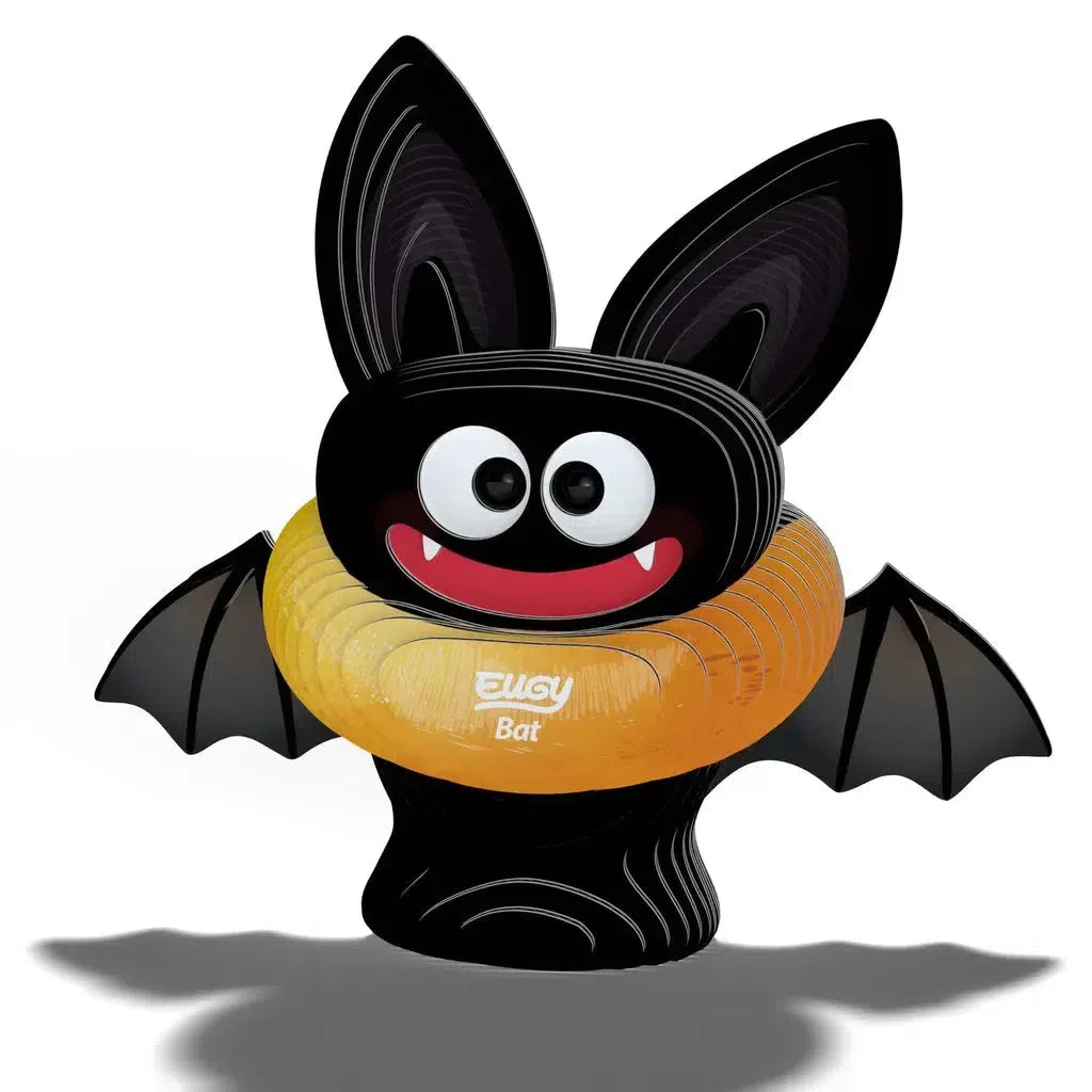 A cartoon bat with large eyes, pointy ears, and fangs holds a yellow balloon ring that says "Bugy Bat," an eco-friendly creation.