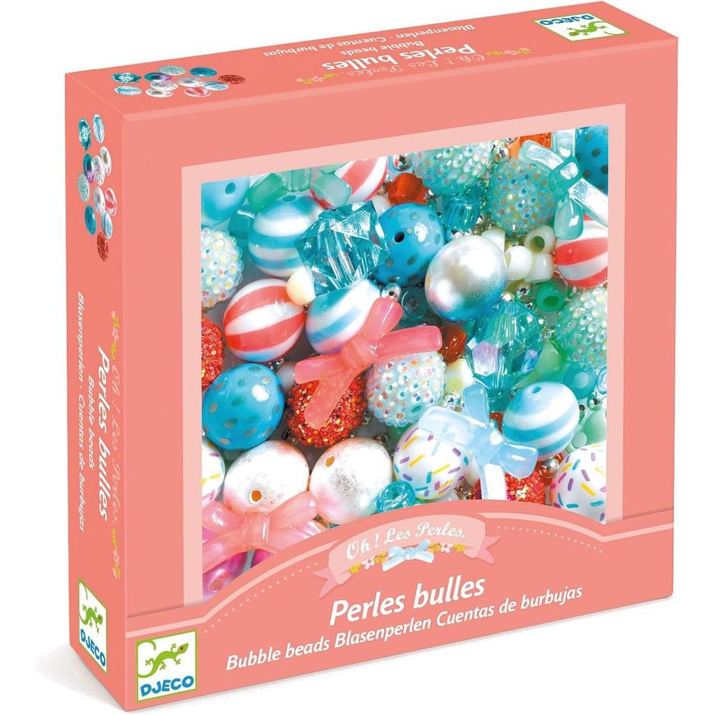 A box of assorted colorful beads in various shapes and sizes, including blue, red, and striped designs, perfect for DJECO Silver Bubble Beads or other educational art crafts for inspired jewelry creations.