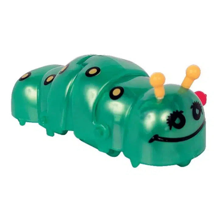 The Z WindUps collection features a green wind-up toy caterpillar with a smiling face, yellow antennae, and black spots on its back. This delightful crawling caterpillar brings joy as it moves across any surface, making it a charming addition to any toy collection.