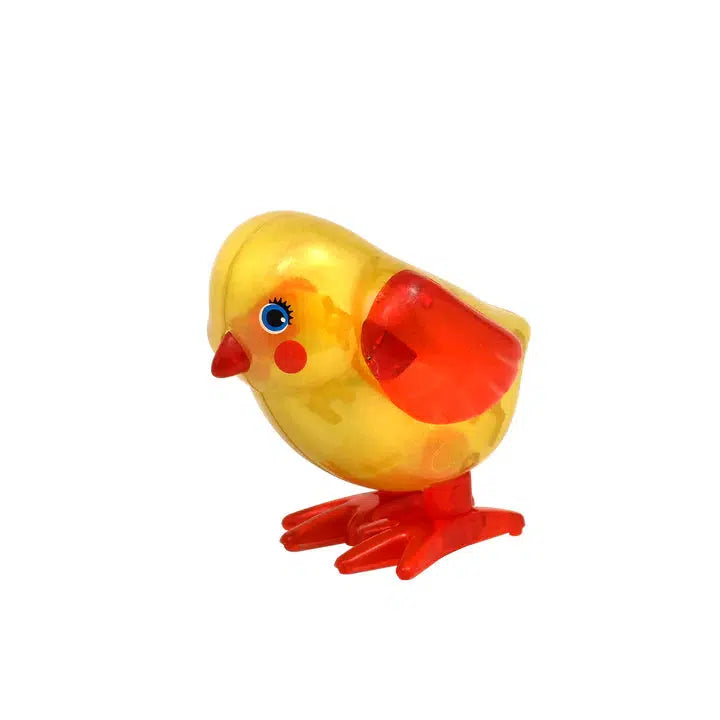 A yellow and orange wind-up toy chick with wide eyes and red cheeks, ready to bring joy with its hopping chicken antics.