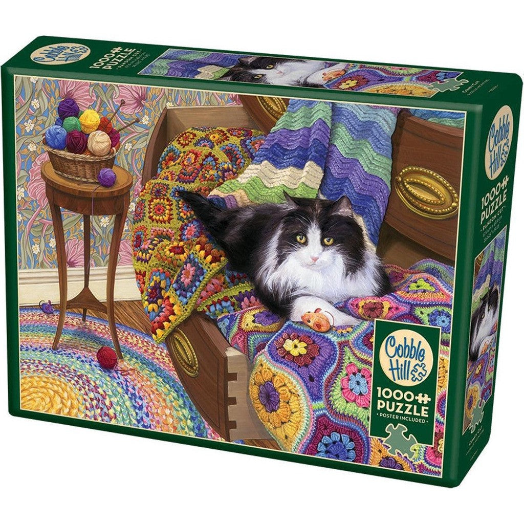 puzzle of a cat resting in open drawers covered in colorful quilts. a table nearby overflows with balls of yarn