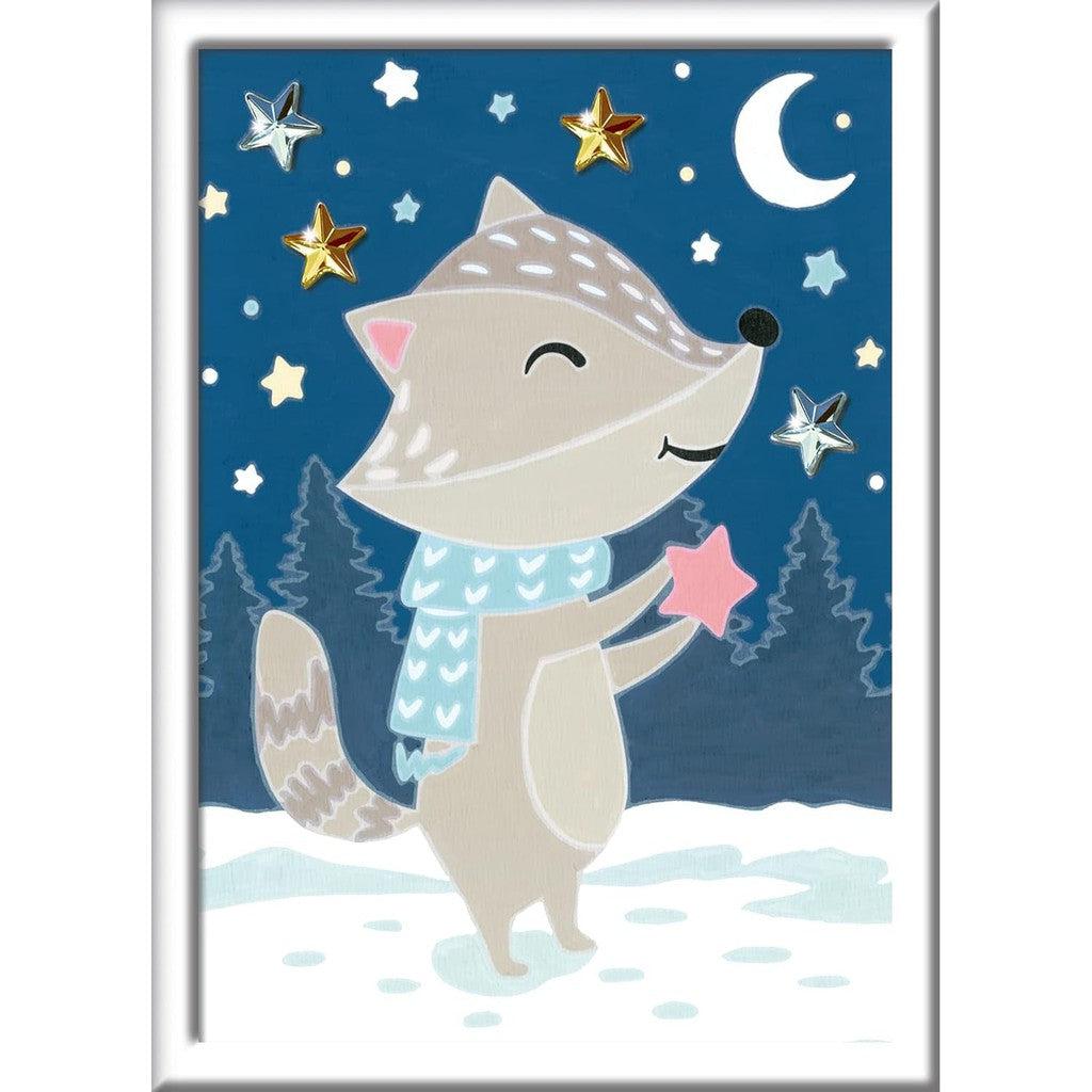 The Ravensburger CreArt Paint by Numbers Kit offers a whimsical canvas featuring a smiling fox in a scarf, holding a star amidst other twinkling stars. Complete with paintbrush and paints, this painting arts and crafts set brings creativity to life.