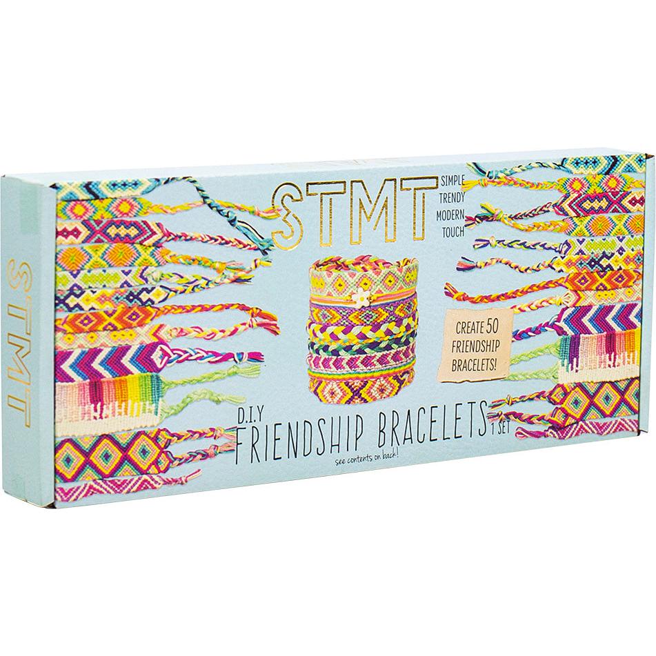 Box of DIY friendship bracelets featuring colorful woven designs with the text "STMT" and "Create 50 Friendship Bracelets" on the front.