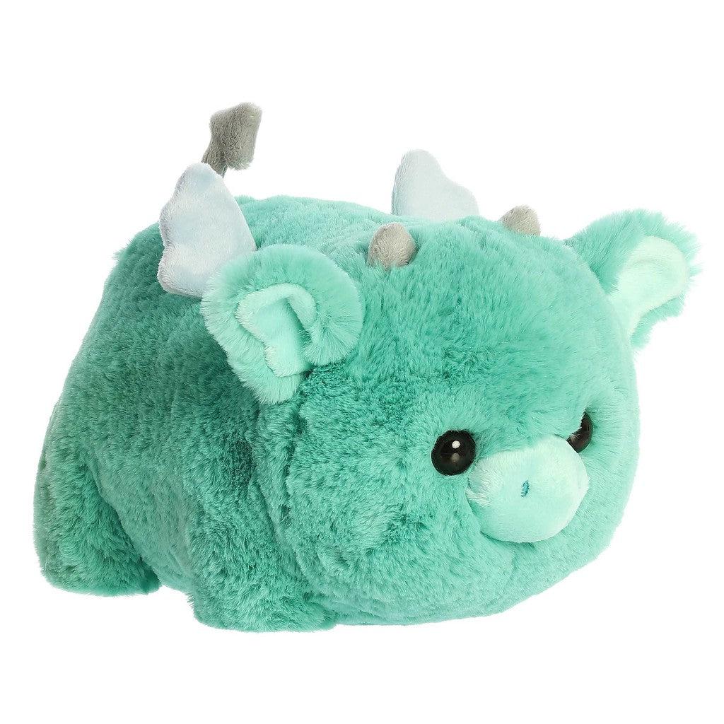 Plump green dragon plush with black eyes, wings, and a tail