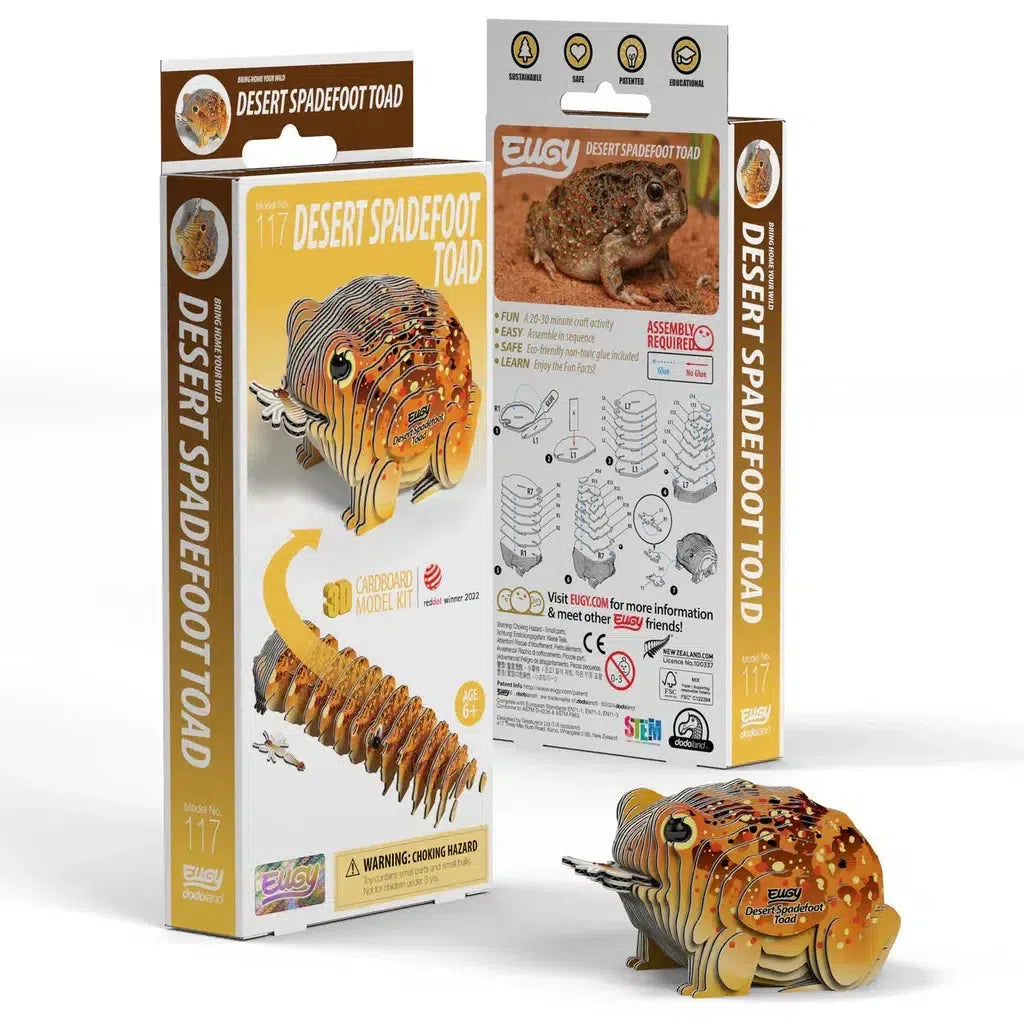 Discover an eco-friendly cardboard model kit of a desert spadefoot toad, featuring a vibrant 3D puzzle design. The packaging and assembly instructions are thoughtfully displayed in the background, enriching your experience with engaging STEM concepts.