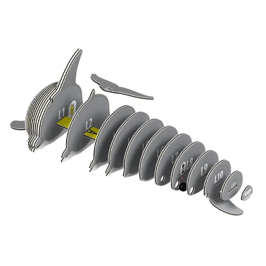 The EUGY 3D puzzle is an eco-friendly, cardboard model of a gray whale crafted from interlocking pieces labeled L1 to L10, plus a separate tail section. This collectable toy offers both educational fun and environmental consciousness.