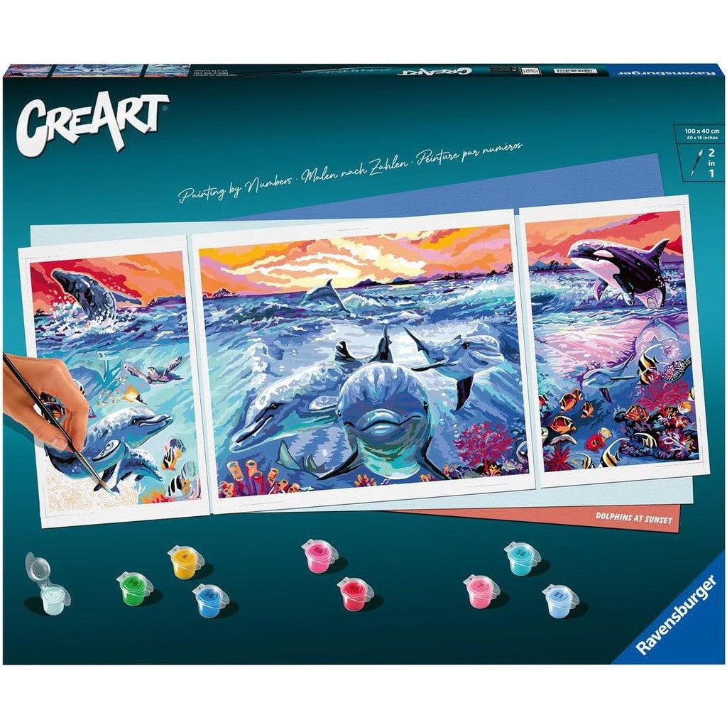 Discover the enchantment of "Dolphins at Sunset," a Paint by Numbers kit that captures dolphins and orcas in a mesmerizing ocean scene. This arts and crafts set comes complete with paint pots and a brush, inviting you to dive into creativity.