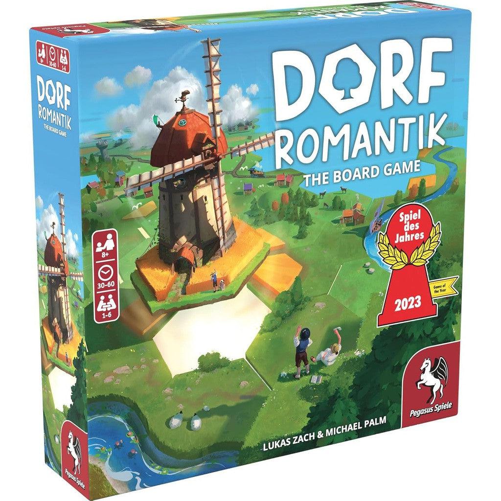 A colorful box of "Dorfromantik: The Board Game" featuring a windmill and countryside illustration. Labelled as a 2023 "Spiel des Jahres" nominee. Designed for 1-6 players, ages 8 and up, with a 30-60 minute playtime.