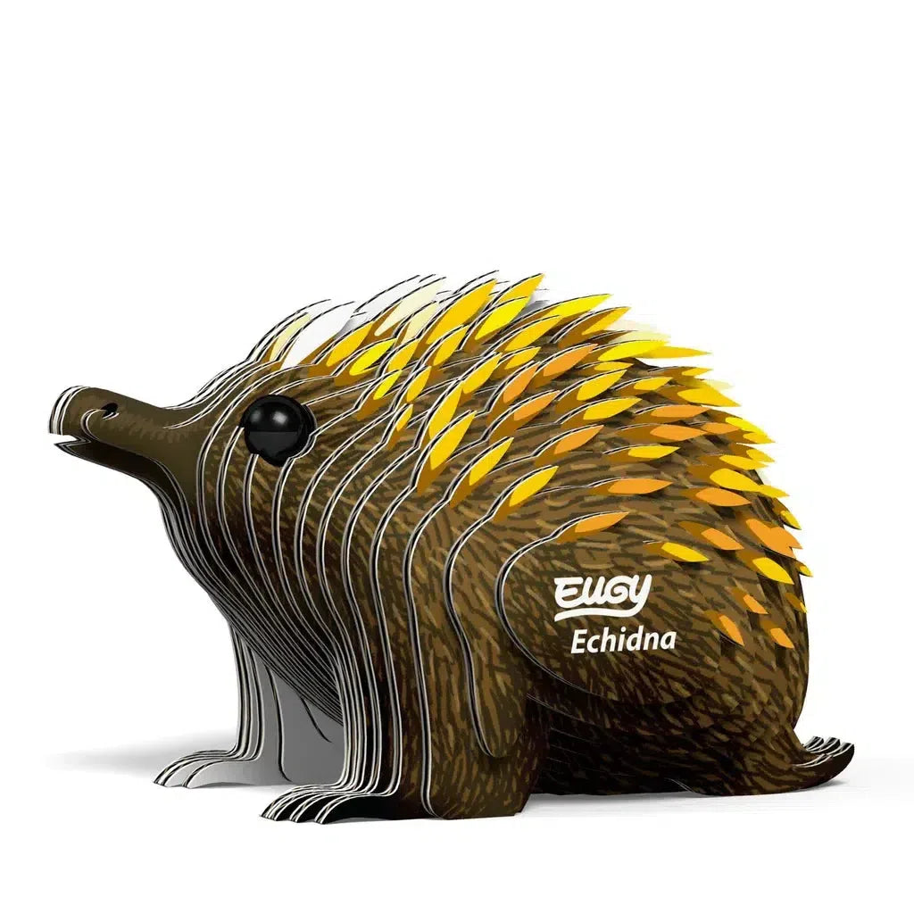 The cardboard model of an echidna features a layered, spiky appearance with yellow-tipped spines. This 3D puzzle, labeled "EUGY Echidna," integrates STEM concepts while being eco-friendly.