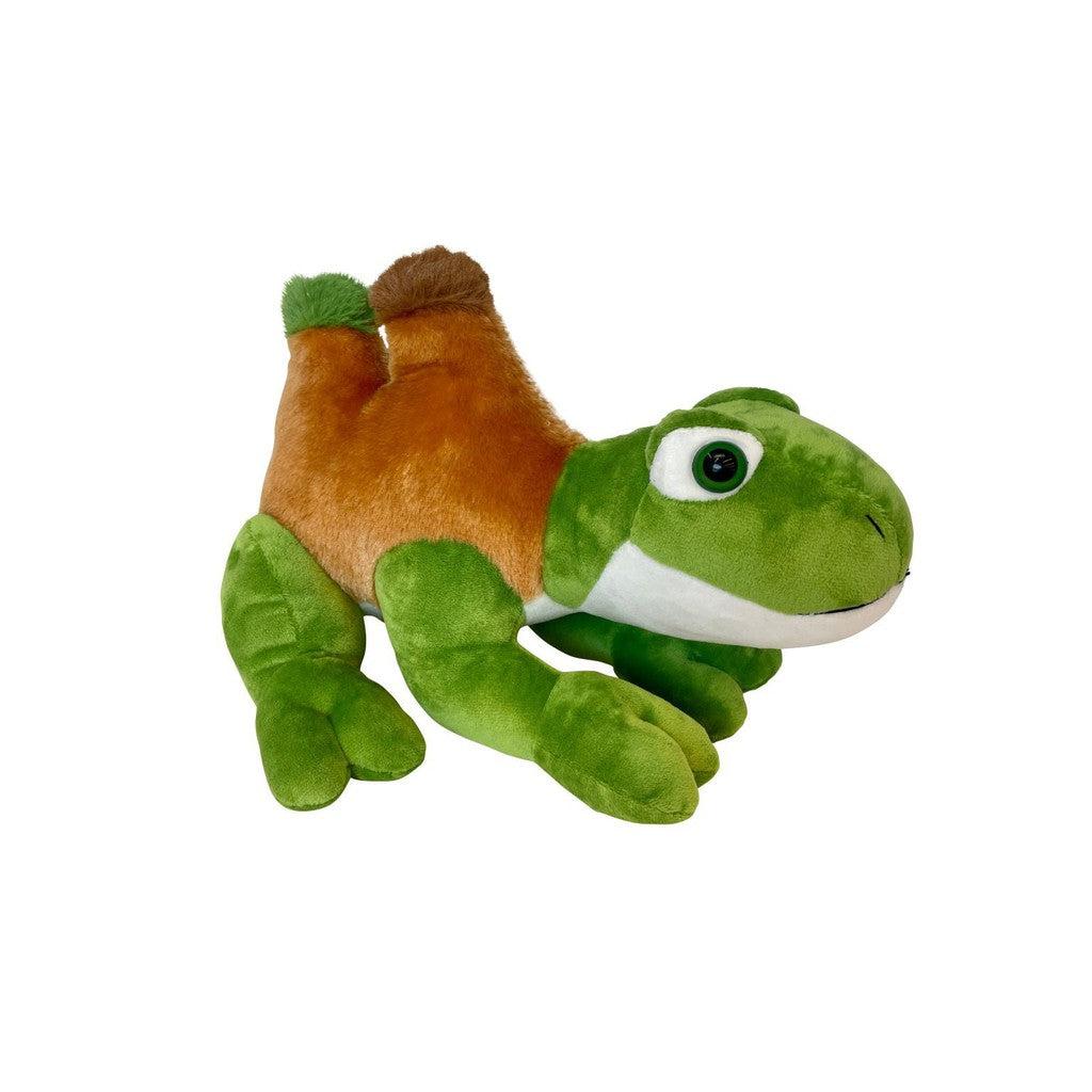 A plush Randimals toy resembling a tortoise with a mix of green and brown colors, featuring large eyes, is positioned against a solid black background, embodying the spirit of diversity and inclusivity in its unique design.