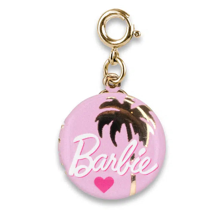 Round charm with "Barbie" text, a palm tree, and a heart on a pink background, perfect for Barbie fans. Attached to a gold-tone clasp, it's an ideal addition to your CHARM IT! bracelet.