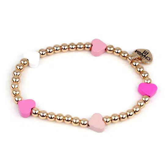 a bracelet of gold beads and pink hearts