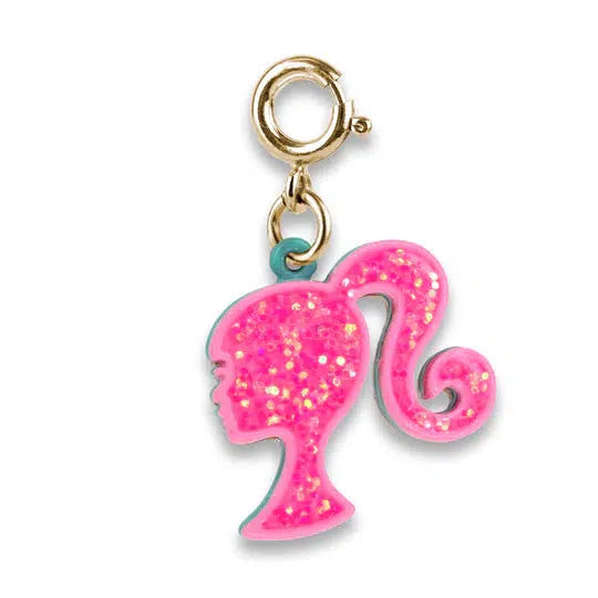 pink glittery charm shaped like the barbie head logo