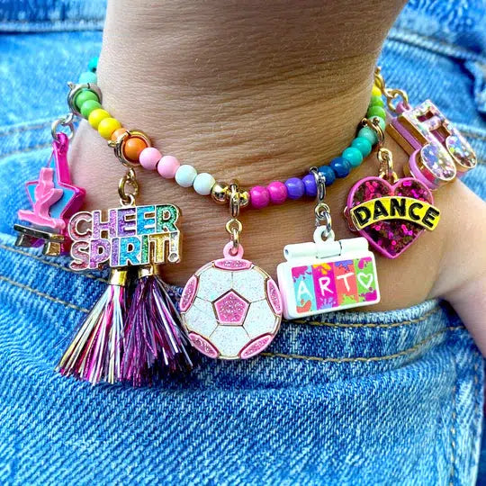 wrist wearing a charm bracelet with sports charms