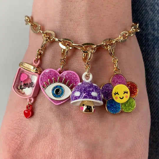 wrist wearing charm bracelet with colorful charms