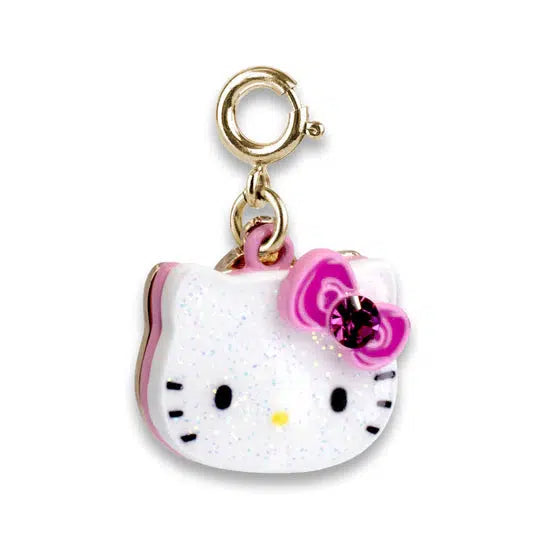 A jewelry charm of a dangly Hello Kitty head with a pink bow