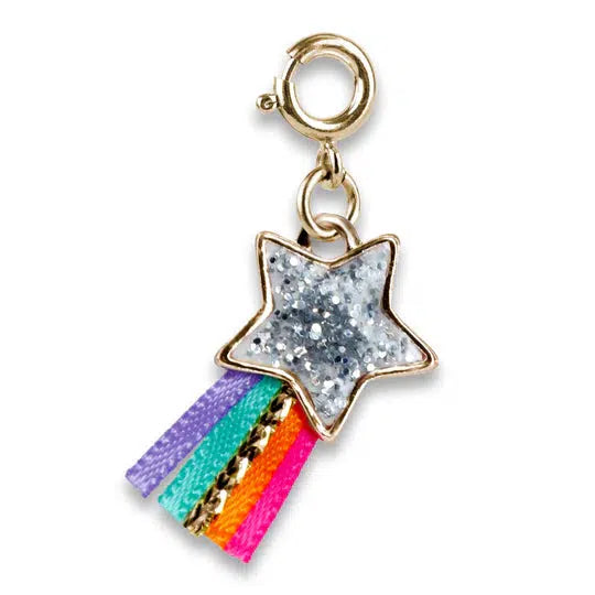 a charm shaped like a shooting star with silver glitter and rainbow tail