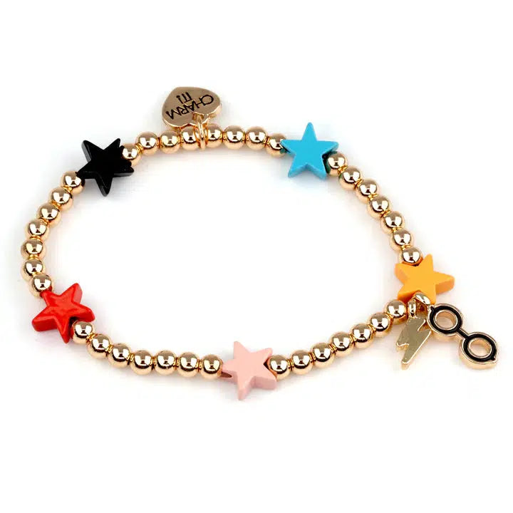 A gold stretch bead bracelet features colorful star charms, a lightning bolt charm, and glasses charm, perfect for any Harry Potter fan immersed in the wizarding world.