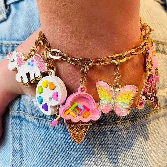 wrist wearing colorful charm bracelet