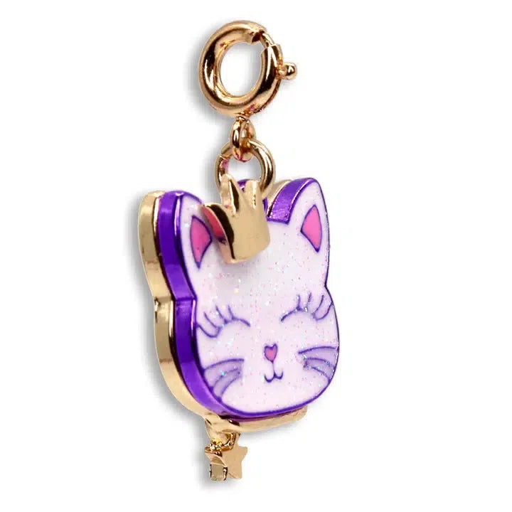 Introducing the CHARM IT! Gold Princess Kitty keychain—a delightful accessory featuring a pink and white cat face with a regal tiny crown. Accented by a purple outline, it boasts a gold-colored clasp and an enchanting star-shaped charm.