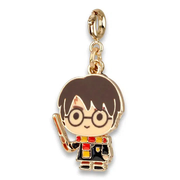 A charming keychain featuring a cartoon character from the wizarding world, holding a wand. Adorned with round glasses, a red and yellow scarf, and a black outfit, it’s the perfect nod to iconic magical adventures.