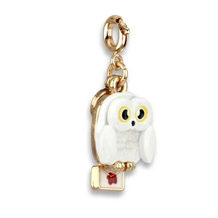 Gold keychain with a charming white owl, reminiscent of the beloved Hedwig, clutching a small red and white envelope that feels straight out of the wizarding world.