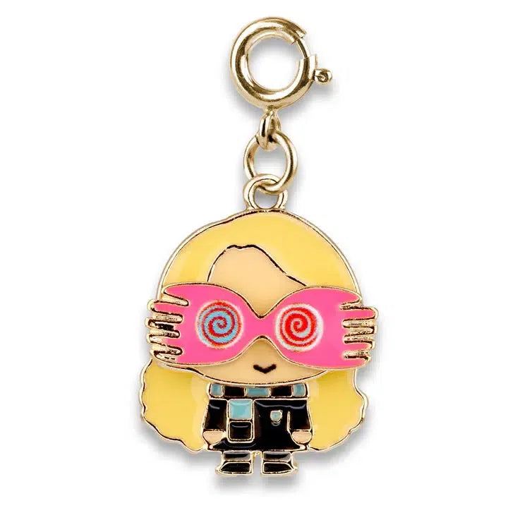 Charming character keychain featuring long blonde hair and oversized pink spiral glasses, reminiscent of Luna Lovegood from the wizarding world. Dressed in a black outfit with a gold-colored chain and clasp, it's the perfect accessory for any Harry Potter fan.