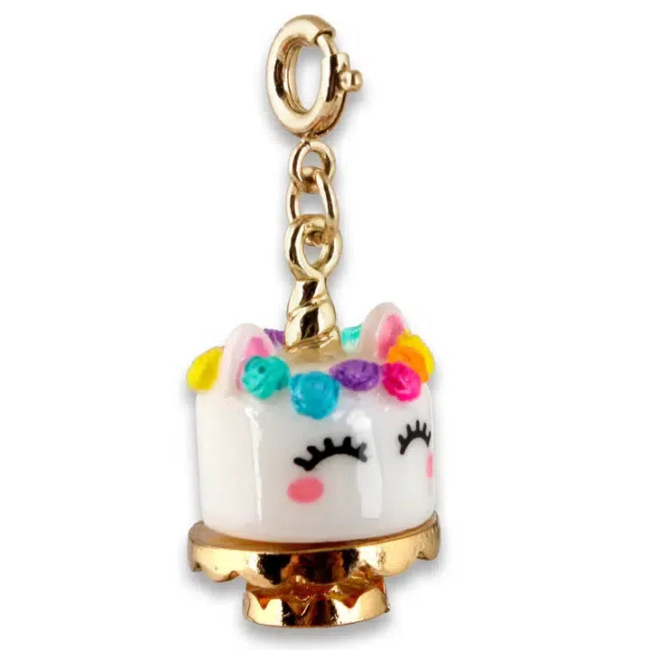 A unicorn-themed charm perfect for a charm bracelet, with a gold clasp. It features a white cylindrical base with ears, closed eyes, and colorful decorations resembling a mane and cheeks. Customize your collection with this whimsical addition.