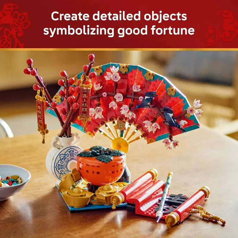 The lego set on a wooden table with the text "Create detailed objects symbolizing good fortune" above it.