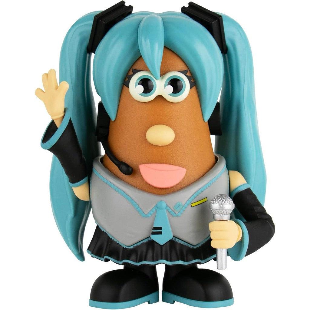 Mr Potato Head dressed as Hatsune Miku with long blue pigtails and a grey and black outfit. She is holding a microphone