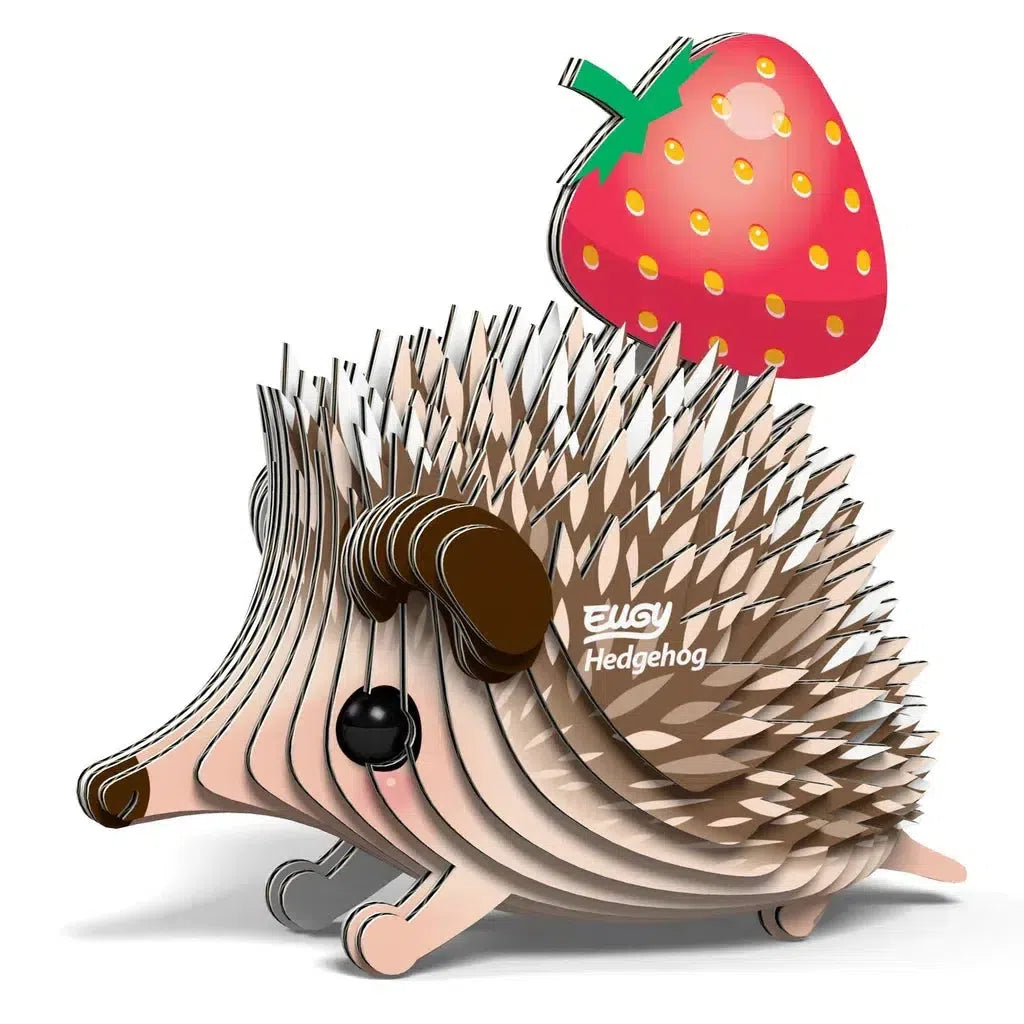 The EUGY Hedgehog 3D puzzle, crafted by Safari Ltd, showcases a layered design perfect for animal lovers. Its adorable features include a cute design and a charming strawberry perched on its back.