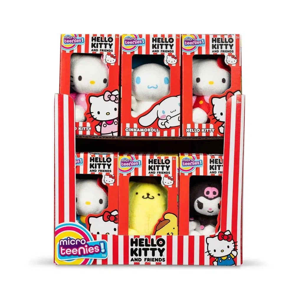 Display box containing Hello Kitty and friends character plush toys, including Cinnamoroll and a whimsical character in a yellow banana suit. The box, with its red and white stripes, makes an ideal gift for fans of the Micro Teenies collection.