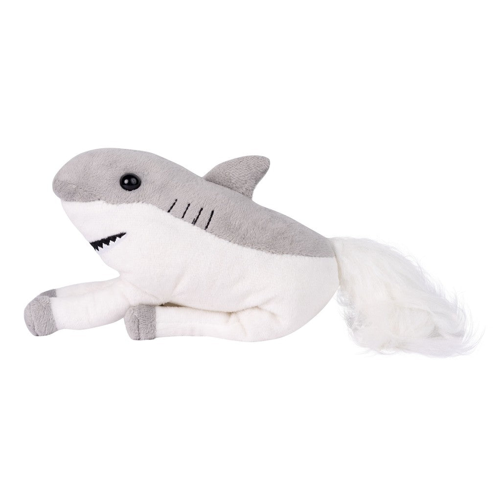 A plush toy combining a shark with a horse tail, featuring a gray body, white underbelly, and black eyes, on a plain background.