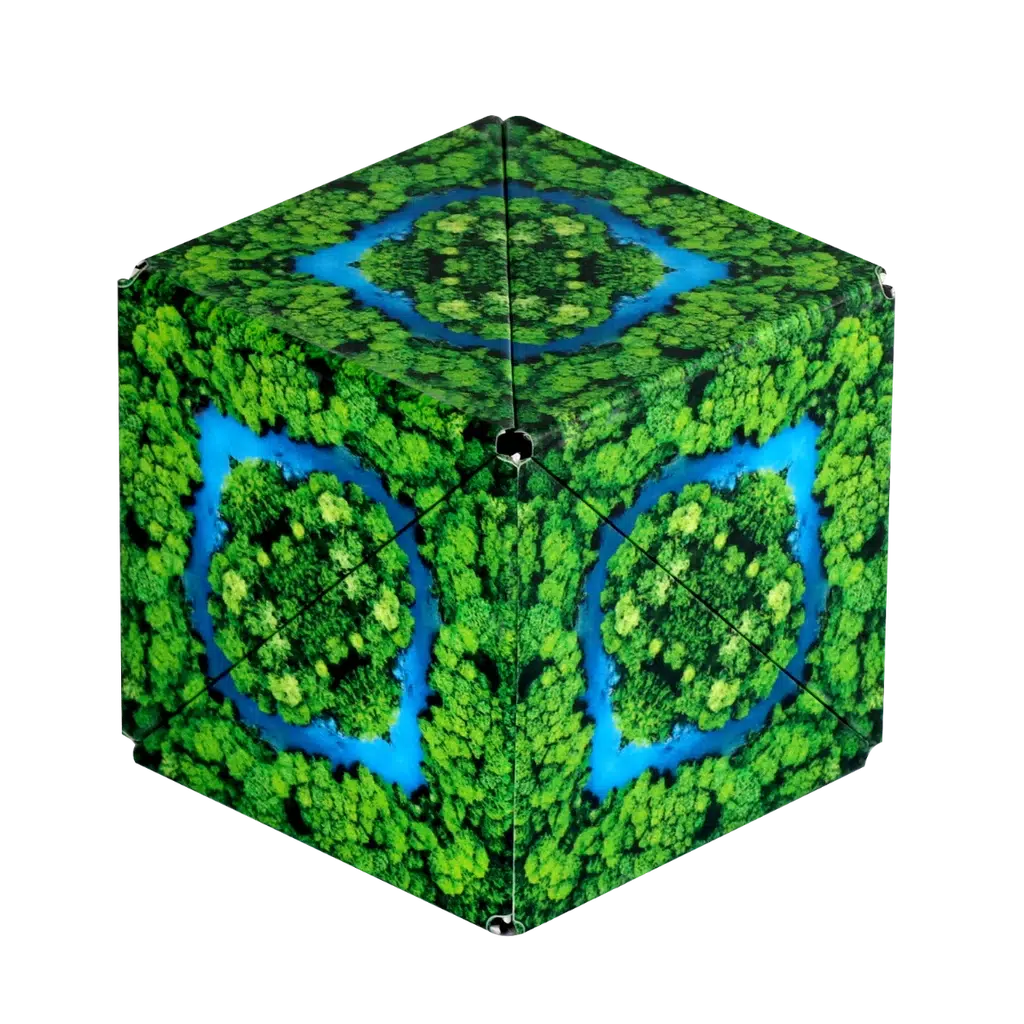 Shashibo hexagonal object with a kaleidoscope pattern of green trees and blue water, creating a symmetrical design. The piece transforms seamlessly with the help of rare earth magnets, merging artistry and innovation.