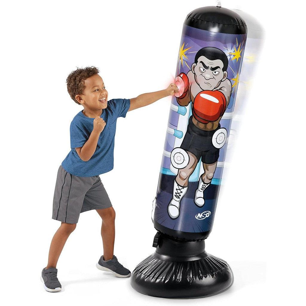 A child energetically punches the NSG Junior Electronic standing inflatable punching bag decorated with a cartoon boxer, delighting in the flashing LED lights that illuminate upon every hit.