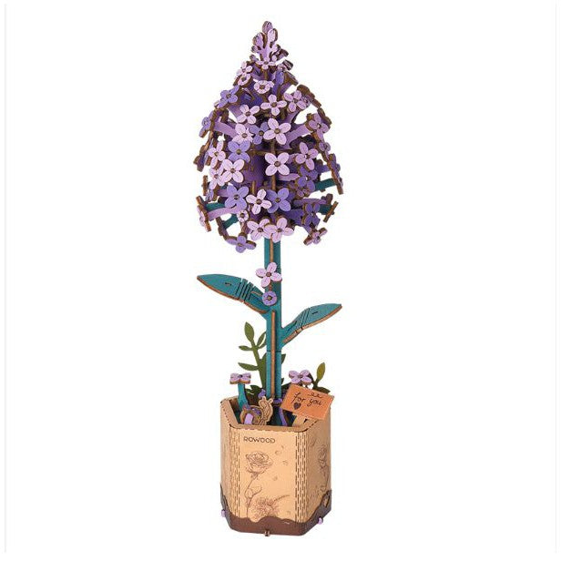 a wooden model of a lilac on a stem. tiny purple flowers make up the top and the bottom is a wooden base so it can stand