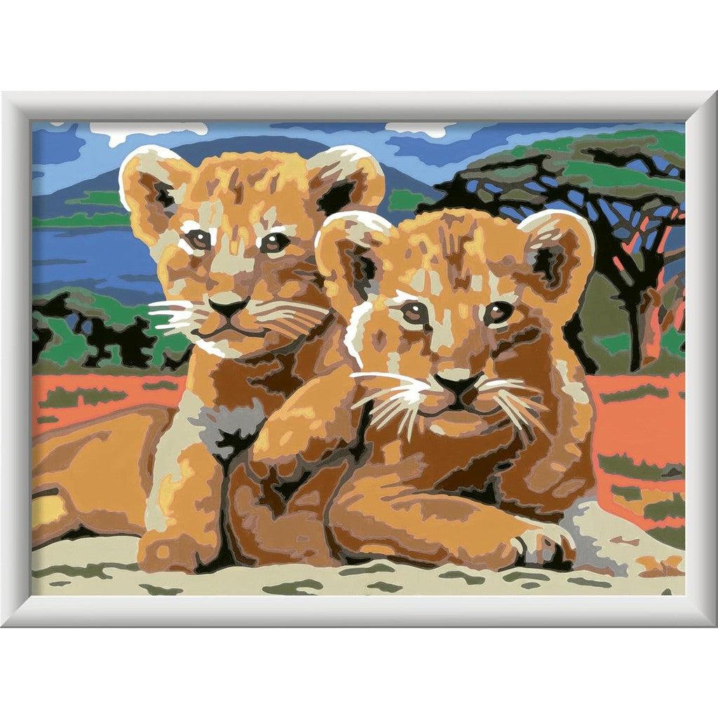 Two lion cubs rest peacefully in this stylized painting, reminiscent of a Ravensburger Little Lion Cubs scene. The savannah background brings the essence of Painting Arts and Crafts to life, offering vibrant colors and a touch of wild charm.