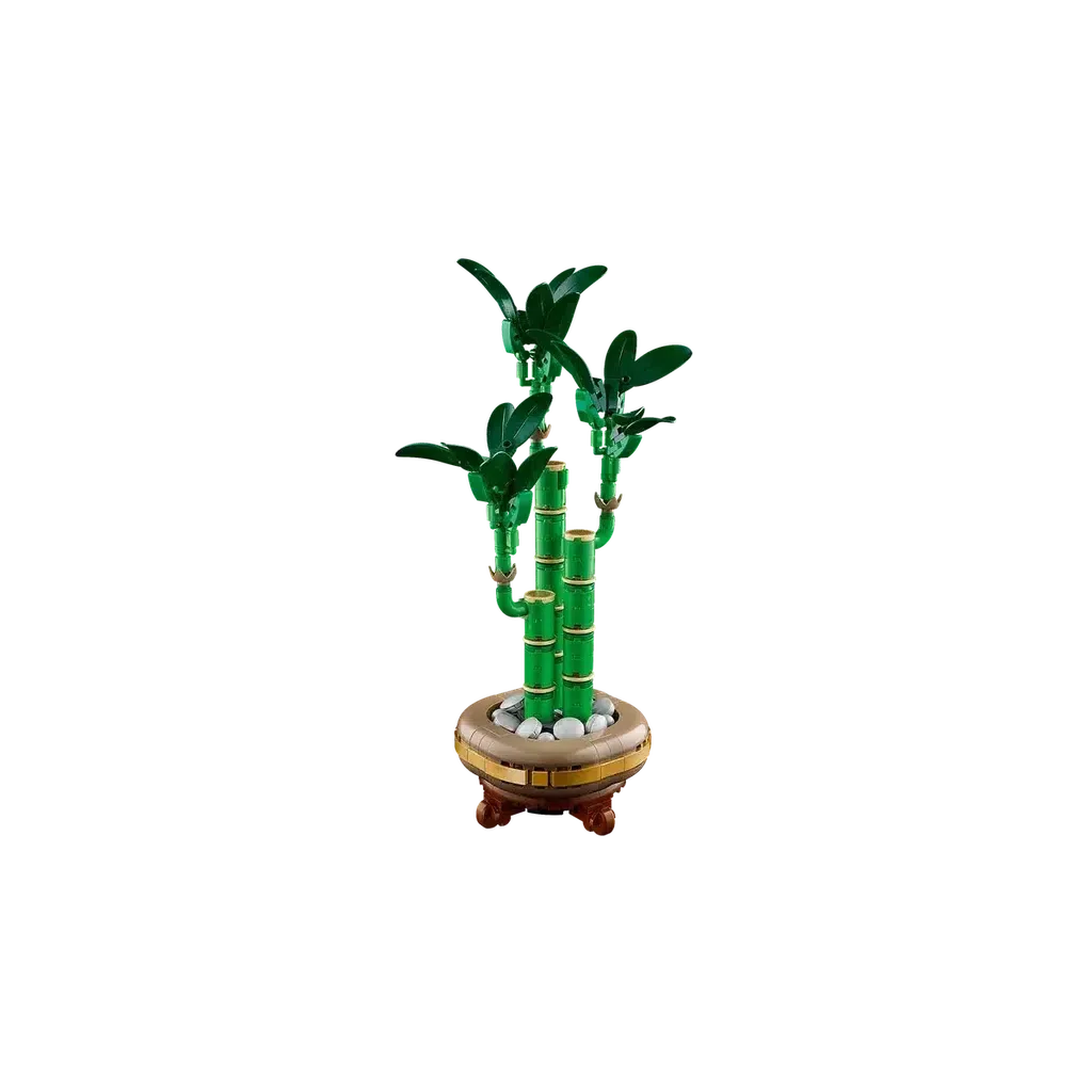 LEGO model of a bamboo plant with green stalks and leaves, set in a circular base with decorative stones.